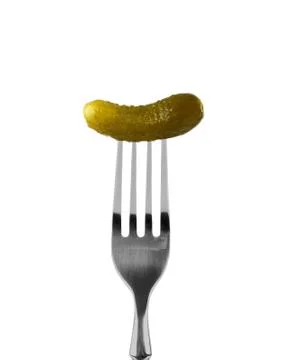 Pickled gherkins cucumber on table fork Stock Photos