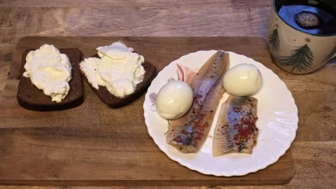 Pickled Herring With Boiled Eggs And Rye Bread Breakfast Stock Footage 325965216