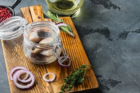 Pickled herring, on gray background with copy space for text Stock Photos