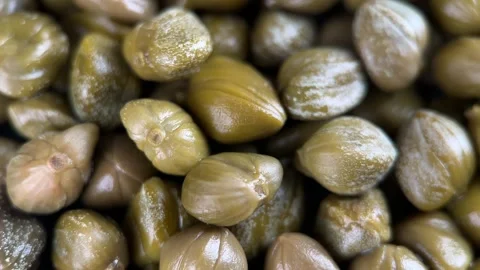 Pickled marinated green capers top view, rotation Stock Footage 296803898
