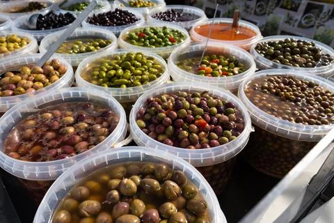 Pickled olives of different varieties at the bazaar. Stock Photos