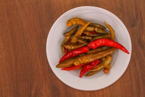 The pickled pepper on plate Stock Photos