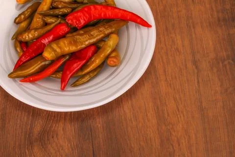 The pickled pepper on plate Stock Photos