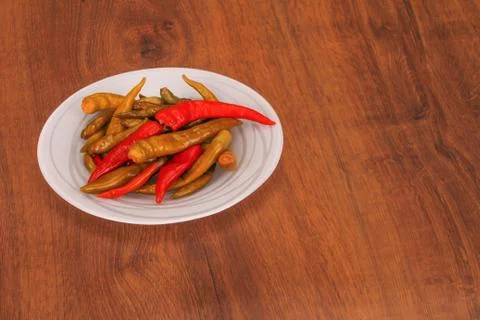 The pickled pepper on plate Stock Photos