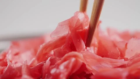 Pickled red ginger for sushi and rolls. Ginger for Asian cuisine. Close-up of Stock Footage 327782552