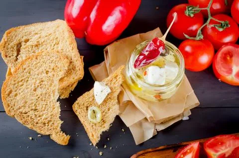 Pickled soft cheese, bread and tomatoes Stockfoto's