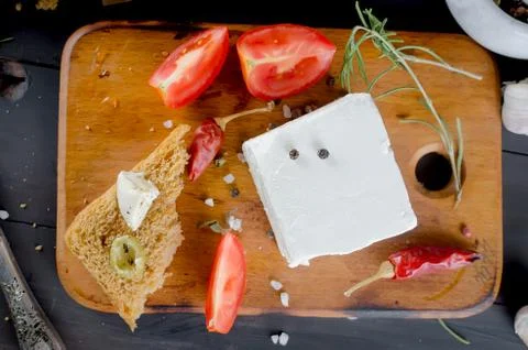 Pickled soft cheese, bread and tomatoes Stock Photos
