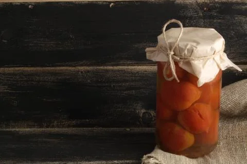 Pickled tomatoes on a black background Stock Photos