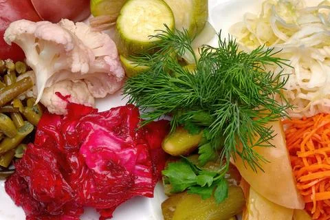 Pickled vegetables with dill on a plate Stock Photos