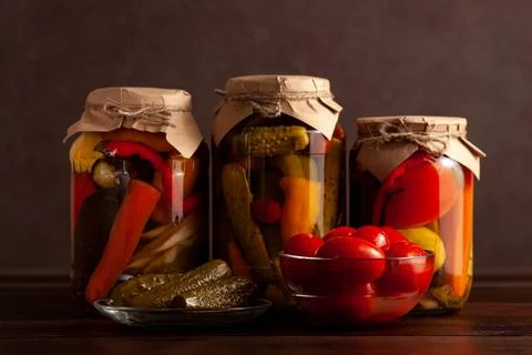 Pickled Vegetables with Fresh Tomatoes on Rustic Table Stock Photos