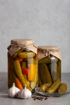 Pickled Vegetables in Jars with Rustic Packaging and Spices Stock Photos