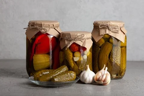 Pickled Vegetables in Rustic Jars with Garlic Stock Photos
