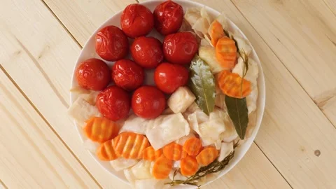 Pickled vegetables with tomatoes and carrots spinning Stock Footage 335836863