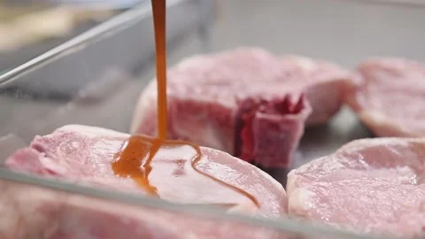 Pickling of pork chops, slow motion. Stock Footage 159401275