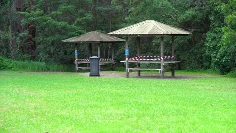 A picknic area in a forest closed due to covid-19 restrictions. Stockbeeldmateriaal 133617523