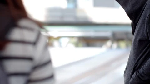 Pickpocketing thief steals pocket from backpacker Stock Footage 119001425