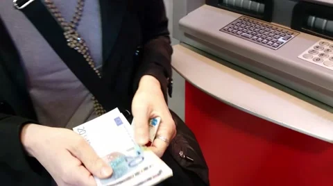 Picks up the banknotes from an ATM Stock Footage 63482360