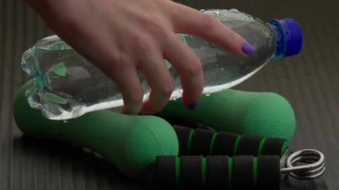 Picks up the bottle Stock Footage 305861211