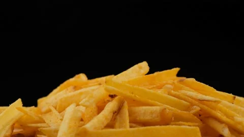 Picks up chips on a black background. Close up Stock Footage 135675172