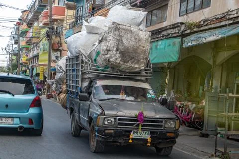 Pickup carries a many large full bags. Stock Photos