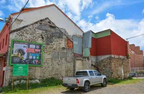 Pickup in front of a beautiful wall of an old house on street in Martinique Stock Photos
