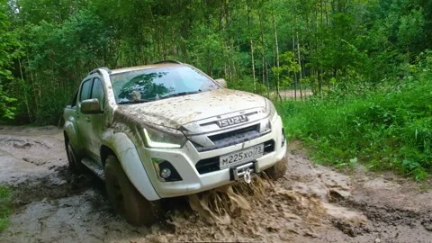 Pickup rides through the forest through mud and puddles Stock Footage 157039587