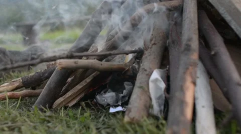 Picnic in the backyard kindling fire in the fireplace Stock Footage 66058482