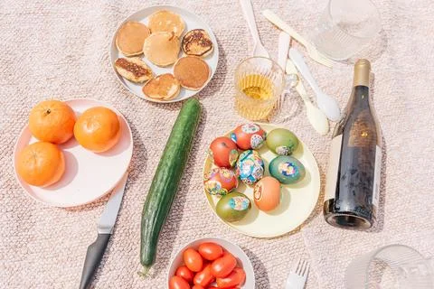 Picnic in nature Easter celebration with painted colored traditional eggs, fr Stock Photos