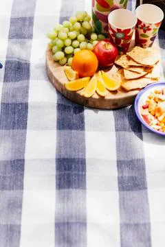 Picnic setting with fresh fruit and snacks Stock Photos