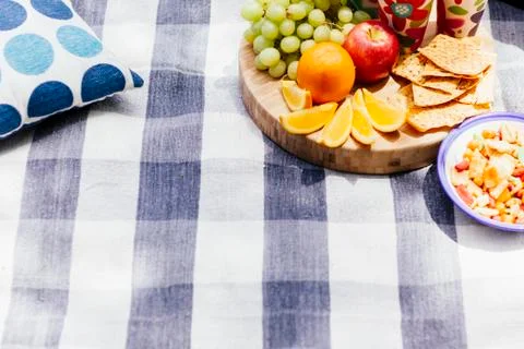 Picnic setting with fresh fruit and snacks Stock Photos