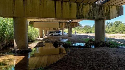 Picnic In The Shade Under A Bridge Stock Photos