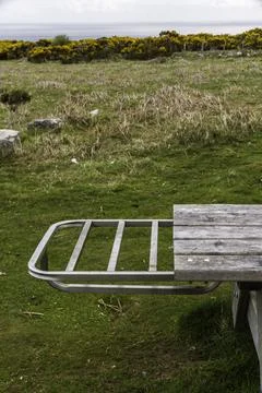Picnic table with bbq shelf close up. Stock Photos
