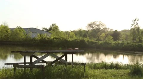 Picnic Table with a lake background Stock Footage 40819915