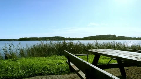 Picnic table by the lake Stock Footage 250476829