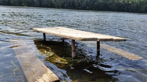 Picnic table in river Stock Photos