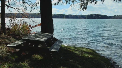 Picnic table on the water (1 of 9) Stock Footage 33908655