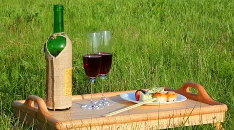Picnic - table with wine and japanese food Stock Footage