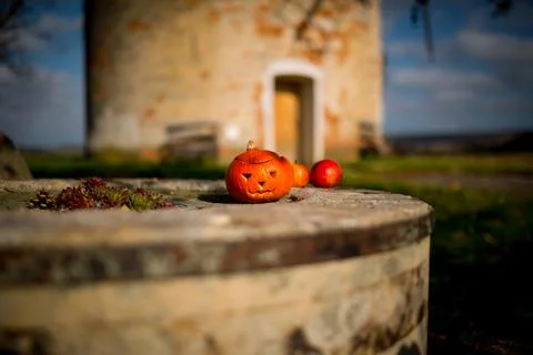 Picnic under a decorated deciduous tree in the background a stone windmill... Stock Photos