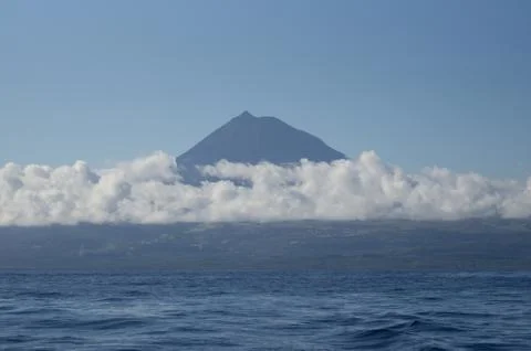 Pico mountain in the clouds Stock Photos