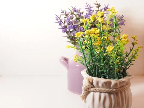 Picture of artificial plastic flower on a ceramic vase Stock Photos