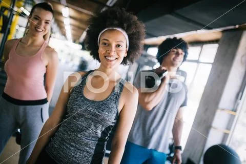 Picture of cheerful fitness team in gym Stock Photos
