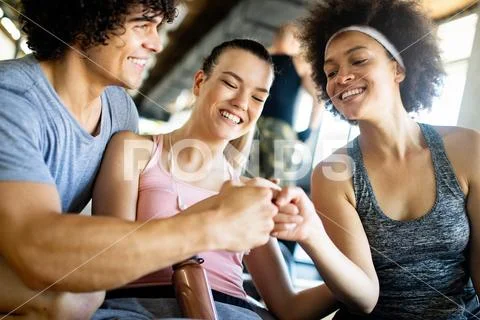 Picture of cheerful fitness team in gym Stock Photos