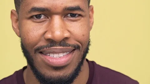Picture of dark-skinned bearded guy expressing happiness smiling nodding Stock Footage