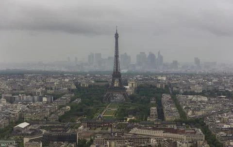 A picture of the Eiffel Tower overlooking the surrounding cityscape of Paris Stock Photos