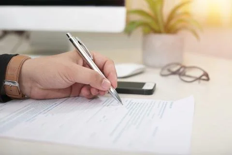 Picture of fill a form on a table Stock Photos