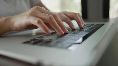 The picture of the finger is typing the keyboard on the notebook. There is a  Stock Footage 154695909
