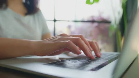 The picture of the finger is typing the keyboard on the notebook. There is a  Stock Footage 154696180
