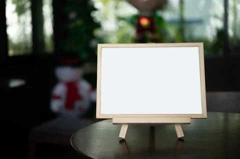 Picture frame placed on a table in a restaurant. Stock Photos
