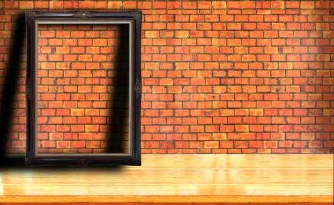 Picture frame on red brick wall Stock Photos