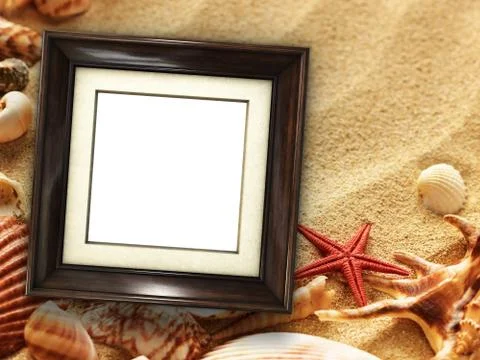 Picture frame on shells and sand background Stock Photos